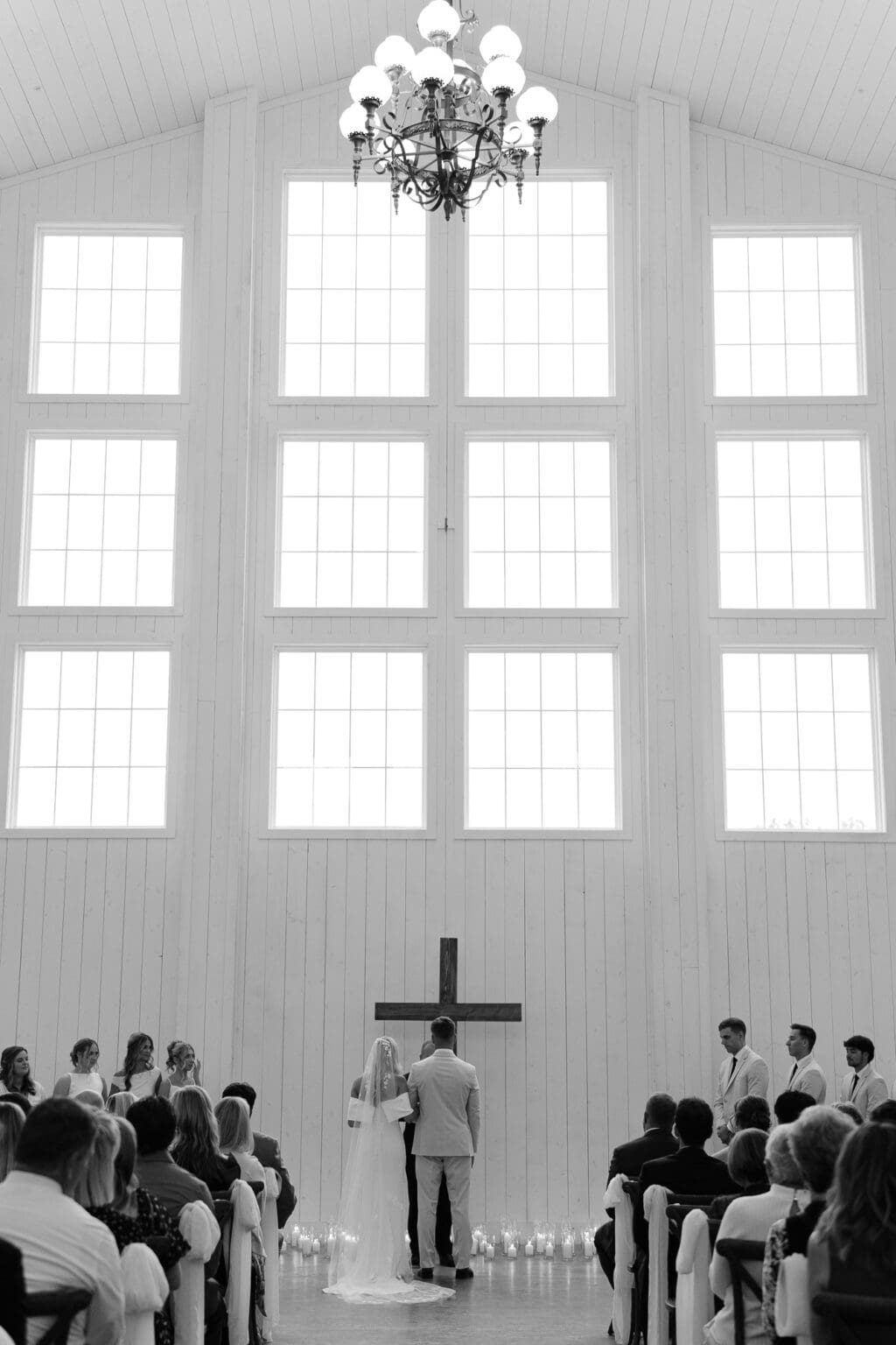 bride and groom at ceremony altar with candlelight
