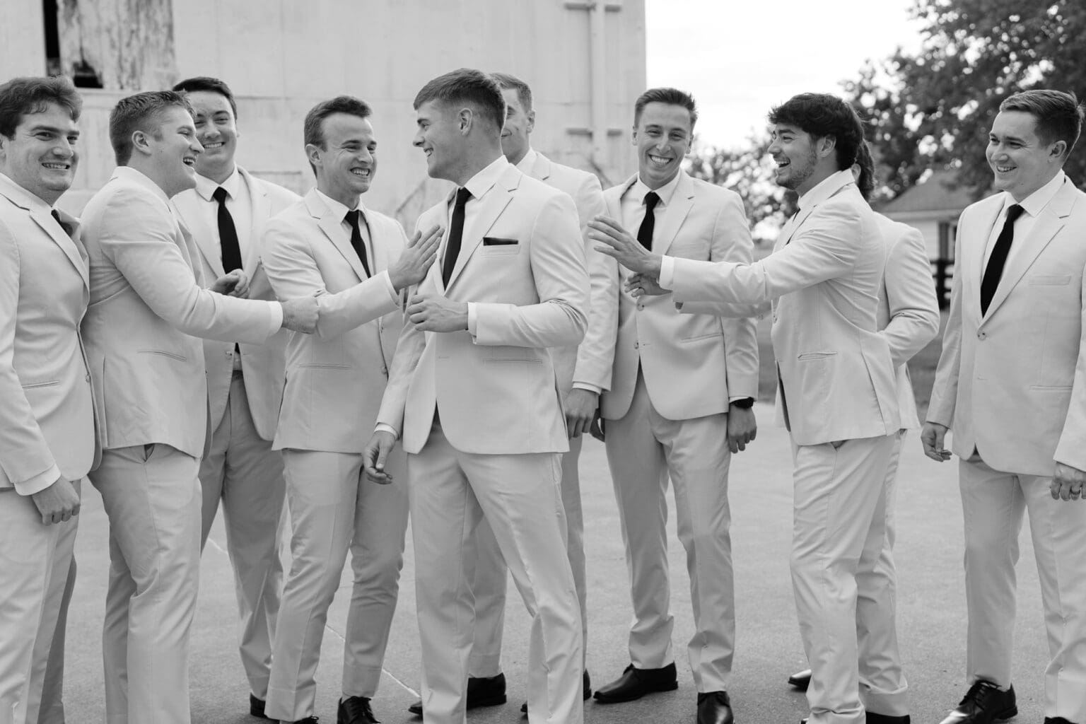 group of men laughing and smiling outdoors at Haven on the Farm