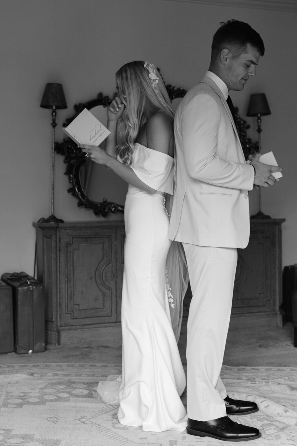 couple dressed in wedding dress and tuxedo sharing vows